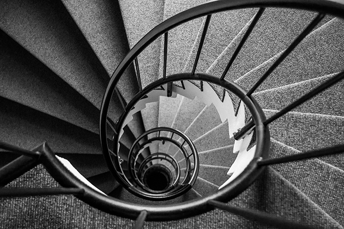 Spiral staircase helps illustrate the rise and fall of interest rates in interest rate risk for credit unions.